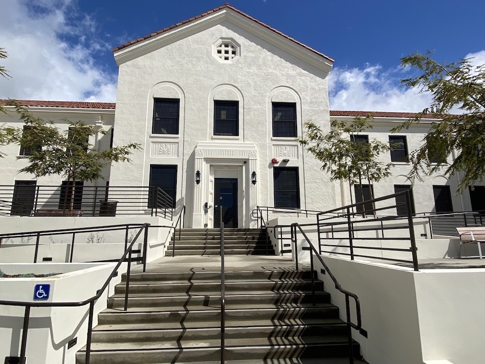Closer view of Building 208 main entrance showing expanded entry stairs and added accessibility ramps